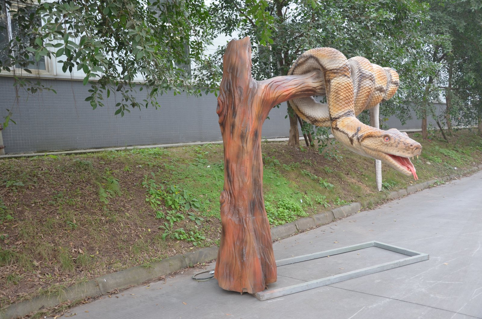 Pneumatic Snake on Tree Trunk